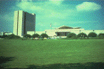 National Library of Medicine complex, looking west from Rockville Pike, Summer (photograph, 8-bit color, GIF87 format, 101 pixels high, 151 pixels wide, 9991 bytes)