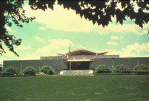 National Library of Medicine building, looking west from Rockville Pike, Summer (photograph, 8-bit color, GIF87 format, 101 pixels high, 149 pixels wide, 10690 bytes)