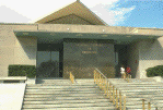 Entrance of National Library of Medicine building, looking west, Summer (photograph, 8-bit color, GIF87 format, 101 pixels high, 149 pixels wide, 10031 bytes)